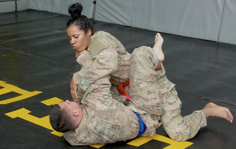 Spc. Dayanna Sanchez, a radiology specialist with the 53rd Head and Neck Surgical Team assigned at Camp Arifjan, Kuwait, and native of Havana, Cuba, competes in the combatives portion of the 2016 USARCENT Soldier of the Year Competition. Sanchez’ hard work and dedication recently afforded her the opportunity to be the only female Soldier to participate in the competition.