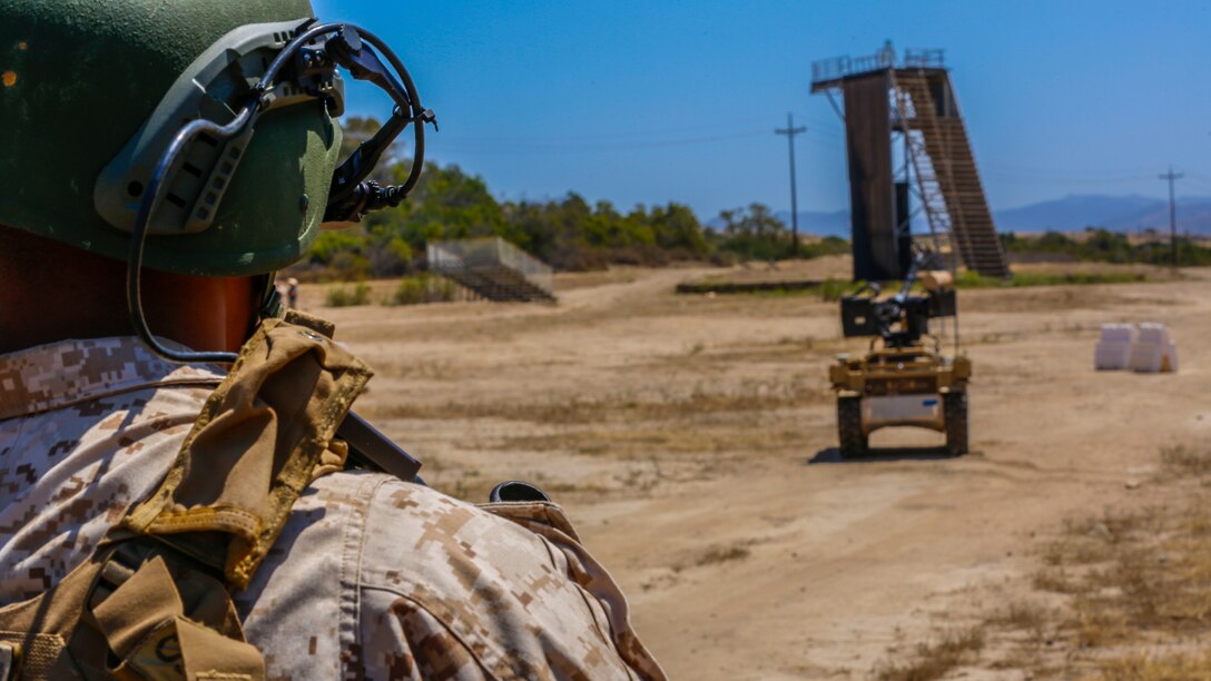 Lance Cpl. Leonardo Reyes, an infantryman with Kilo Company, 3rd Battalion, 5th Regiment, controls the weapon payload of the robotic vehicle modular system aboard Camp Pendleton, Calif., June 26, 2016. Reyes and other Marines from his unit were learning how to operate the system in preparation of exercise Rim of the Pacific with partner nations. (U.S. Marine Corps photo by Lance Cpl. Frank Cordoba/Released)