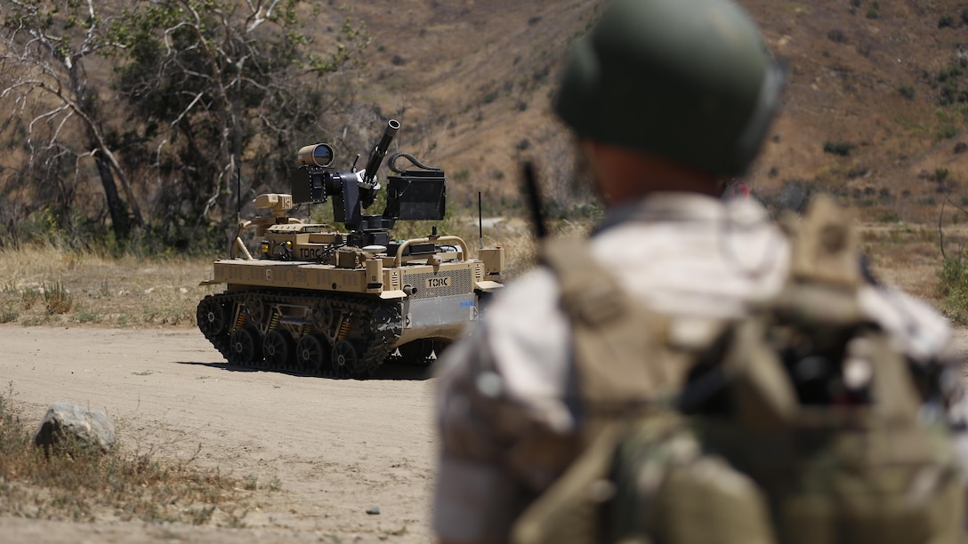 Lance Cpl. Mark Oloughlin, an infantryman with Kilo Company, 3rd Battalion, 5th Regiment, operates the weapon payload of the robotic vehicle modular system aboard Camp Pendleton, Calif., June 23, 2016. The system will be tested during the Southern California portion of exercise Rim of the Pacific in a realistic scenario that focuses on amphibious contingency operations and interoperability between the U.S. and partner nations. (U.S. Marine Corps photo by Lance Cpl. Frank Cordoba/Released)