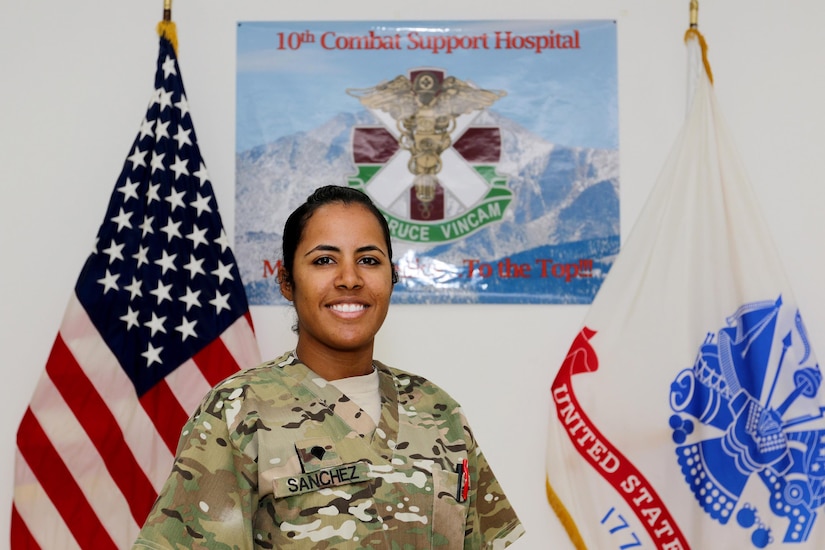 Spc. Dayanna Sanchez, a radiology specialist with the 53rd Head and Neck Surgical Team assigned at Camp Arifjan, Kuwait, and native of Havana, Cuba, poses for a picture June 28, 2016. Sanchez’ hard work and dedication recently afforded her the opportunity to be the only female Soldier to participate in the USARCENT Soldier of the Year Competition.