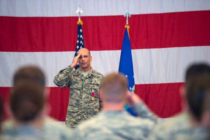 U.S. Air Force Col. Peter Breed, 23d Medical Group outgoing commander, renders his final salute to the Tiger Medics of the 23d MDG during a change of command ceremony, July 8, 2016, at Moody Air Force Base, Ga. Upon relinquishing command, Breed will move on to Director of Biomedical Sciences Corps Operations at Joint Base San Antonio-Lackland’s Kelly Annex Field, Texas. (U.S. Air Force photo by Airman 1st Class Greg Nash/Released)