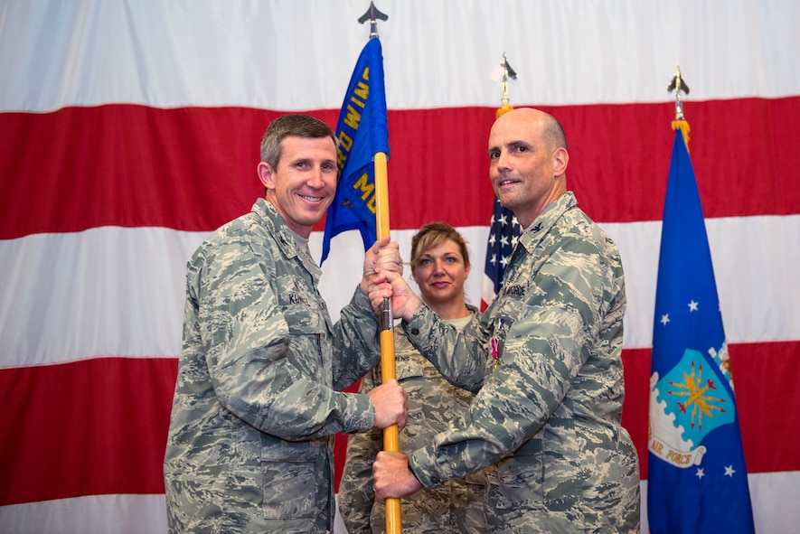 U.S. Air Force Col. Peter Breed, right, relinquishes command of the 23d Medical Group during a change of command ceremony, July 8, 2016, at Moody Air Force Base, Ga. Under his leadership, the 23d MDG garnered the 2014 Air Combat Command Patient Safety Team Award and 10 Airmen were awarded ACC individual awards. (U.S. Air Force photo by Airman 1st Class Greg Nash/Released)