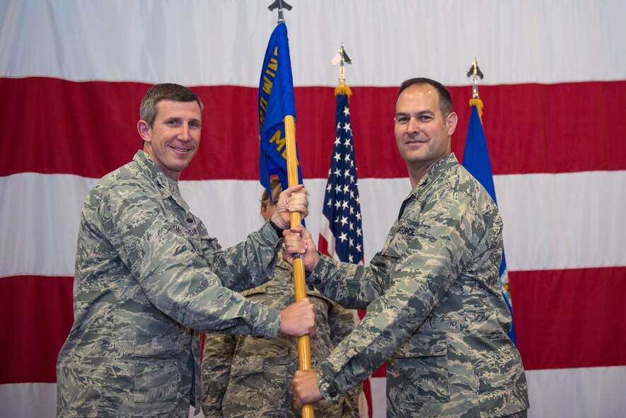 U.S. Air Force Col. Jay Vietas, right, assumes command of the 23d Medical Group, during a change of command ceremony, July 8, 2016, at Moody Air Force Base, Ga. Vietas previously served as the 48th Medical Operations Squadron commander, at Royal Air Force Lakenheath, England. (U.S. Air Force photo by Airman 1st Class Greg Nash/Released)