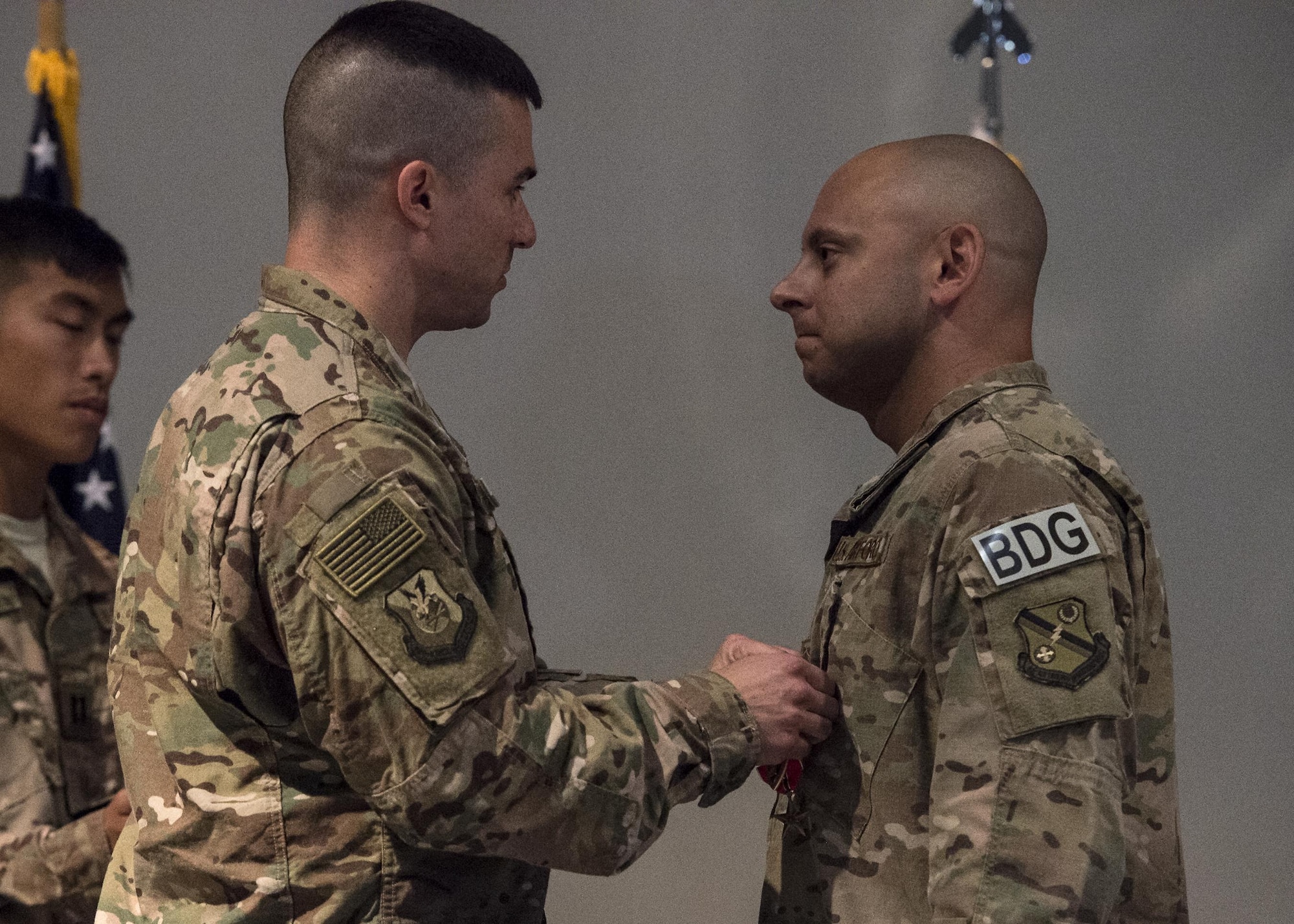 U.S. Air Force Col. Kevin Walker, left, 820th Base Defense Group commander, pins a Purple Heart medal on Master Sgt. Aaron Frederick, 93d Air Ground Operations Wing command chief executive assistant, July 8, 2016, at Moody Air Force Base, Ga. One of the medals Frederick received was the Bronze Star, which recognizes acts of heroism performed in ground combat and is annotated with a bronze “V”, which designates valor. (U.S. Air Force photo by Airman 1st Class Janiqua P. Robinson/Released)