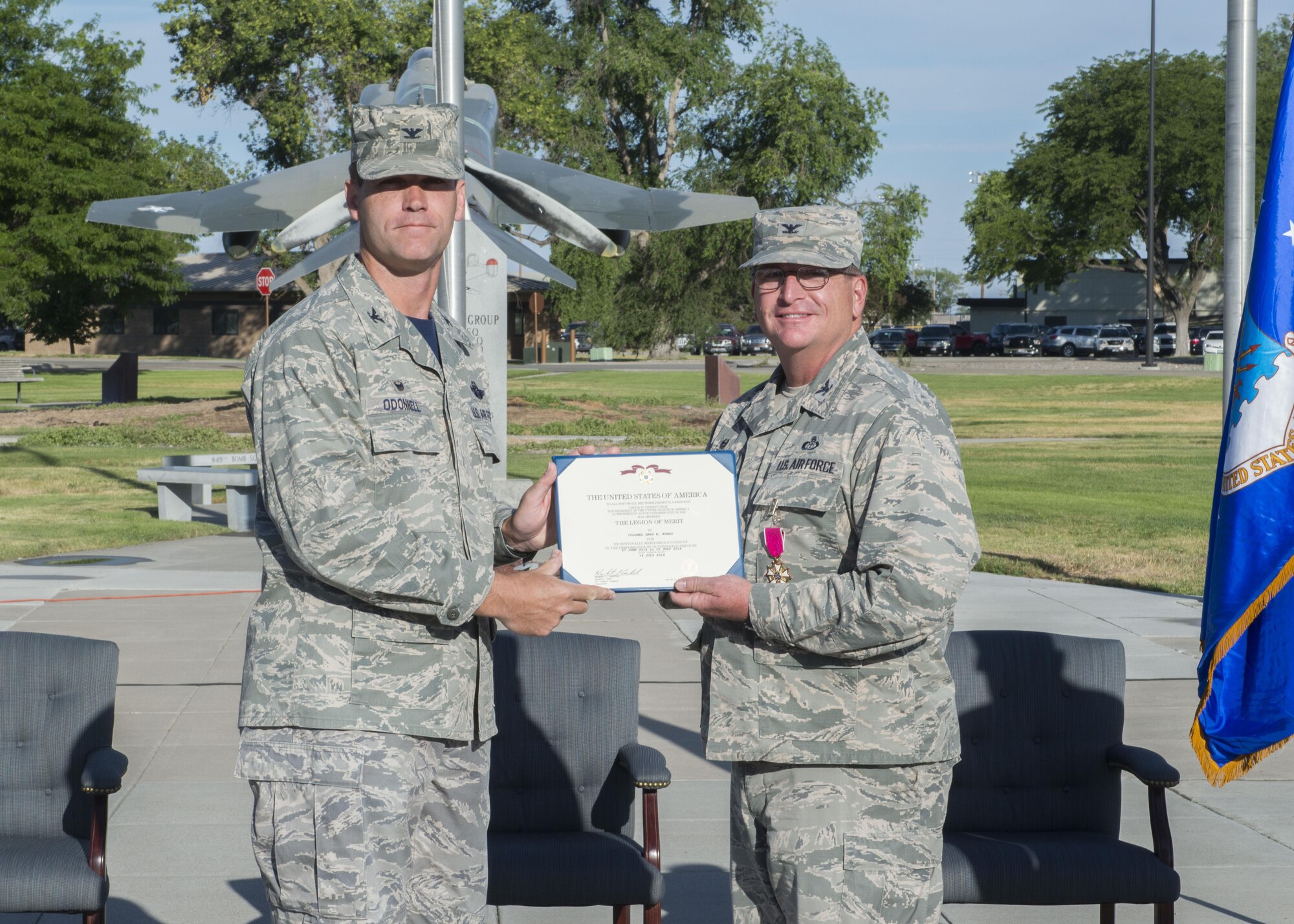 Col. Jefferson O’Donnell (left), 366th Fighter Wing commander, presents Col. Gary Kubat, 366th Mission Support Group commander, the Legion of Merit July 8, 2016, at Mountain Home Air Force Base, Idaho. As 366th MSG commander, Kubat commands a group of 2,000 personnel. (U.S. Air Force photo by Senior Airman Malissa Lott/RELEASED)