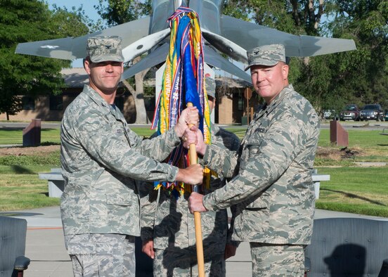 Col. John Blackwell (right) assumes command of the 366th Mission Support Group from Col. Jefferson O’Donnell, 366th Fighter Wing commander, July 8, 2016, at Mountain Home Air Force Base, Idaho. Previously, Blackwell served as Chief, Air Force Portfolio Management Division, Air Force Civil Engineer Center at Joint Base San Antonio-Lakeland, Texas. (U.S. Air Force photo by Senior Airman Malissa Lott/RELEASED