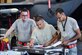 Staff Sgt. Jose Lasanta-Falcon (right), 4th Aircraft Maintenance Squadron load crew team chief, completes final checks while Airman 1st Class Dorian Estrella (center) and Taylor Stevenson (left), 4th AMXS load crew members, look on during a Load Crew of the Quarter competition, July 7, 2016, at Seymour Johnson Air Force Base, North Carolina. Crews of three Airmen from each aircraft maintenance unit on base competed against each other for the best time while ensuring accuracy, serviceability and efficiency. (U.S. Air Force photo/Airman Shawna L. Keyes)