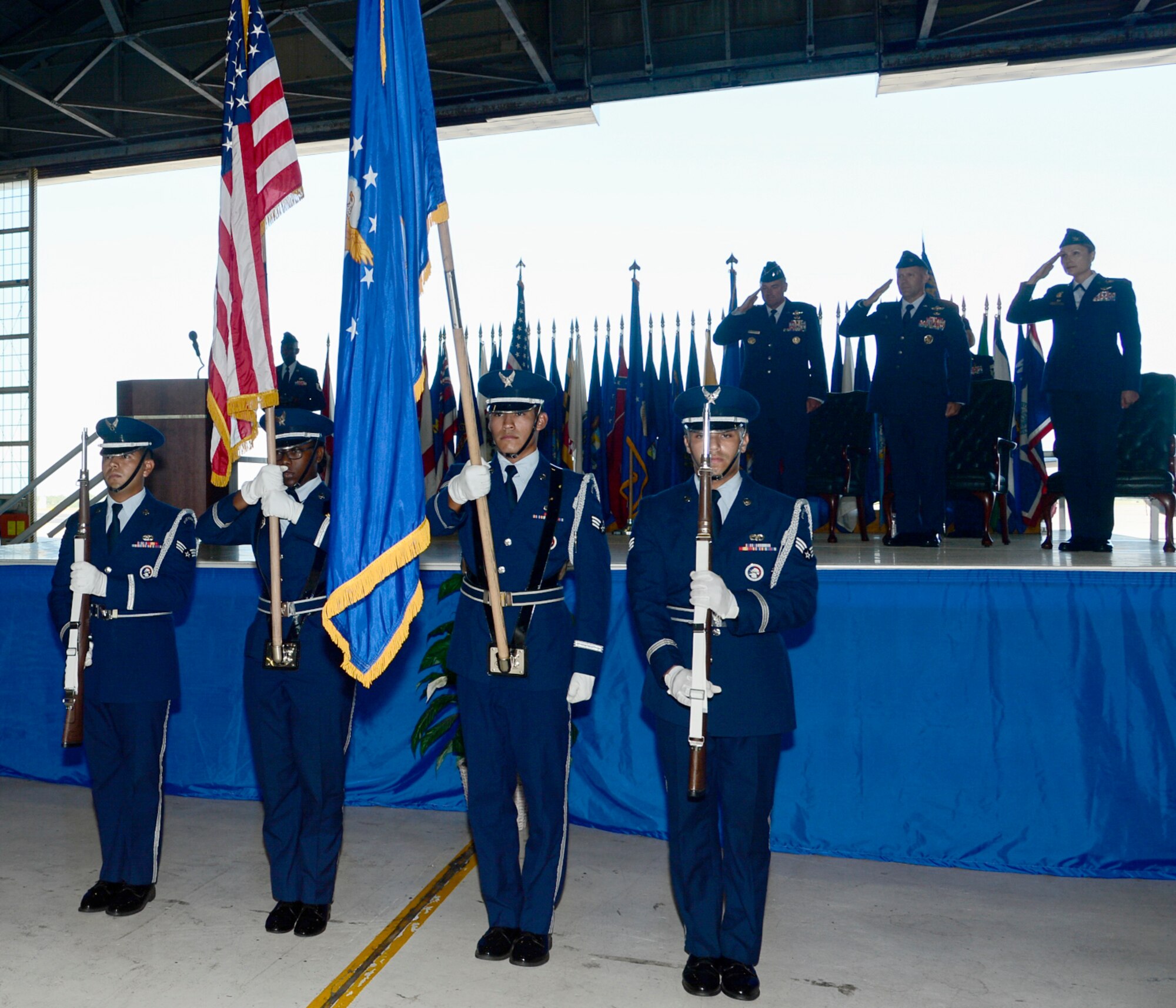 Base Honor Guardsmen from the 6th Force Support Squadron present the colors during the 6th Air Mobility Wing (AMW) change of command ceremony at MacDill Air Force Base, Fla., July 8, 2016. The ceremony marked the beginning of Col. April Vogel’s tenure as commander of the 6th AMW. (U.S. Air Force photo by Tech. Sgt. Krystie Martinez)
