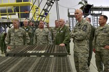 Lt. Gen. L. Scott Rice, middle, director of the Air National Guard, observes the maintenance of a CV-22 Osprey at Hurlburt Field, Fla., July 7, 2016. Rice came to Hurlburt Field to get an overview on the ANG involvement in Air Force Special Operations Command. (U.S. Air Force photo by Senior Airman Jeff Parkinson)