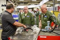 Brian Sawyer, an on-site quick response team technician with the Air Force Special Operations Command, briefs Lt. Gen. L. Scott Rice, middle, director of the Air National Guard, during his visit to Hurlburt Field, Fla., July 7, 2016. Rice came to Hurlburt Field to get an overview on the ANG involvement in Air Force Special Operations Command. (U.S. Air Force photo by Senior Airman Jeff Parkinson)