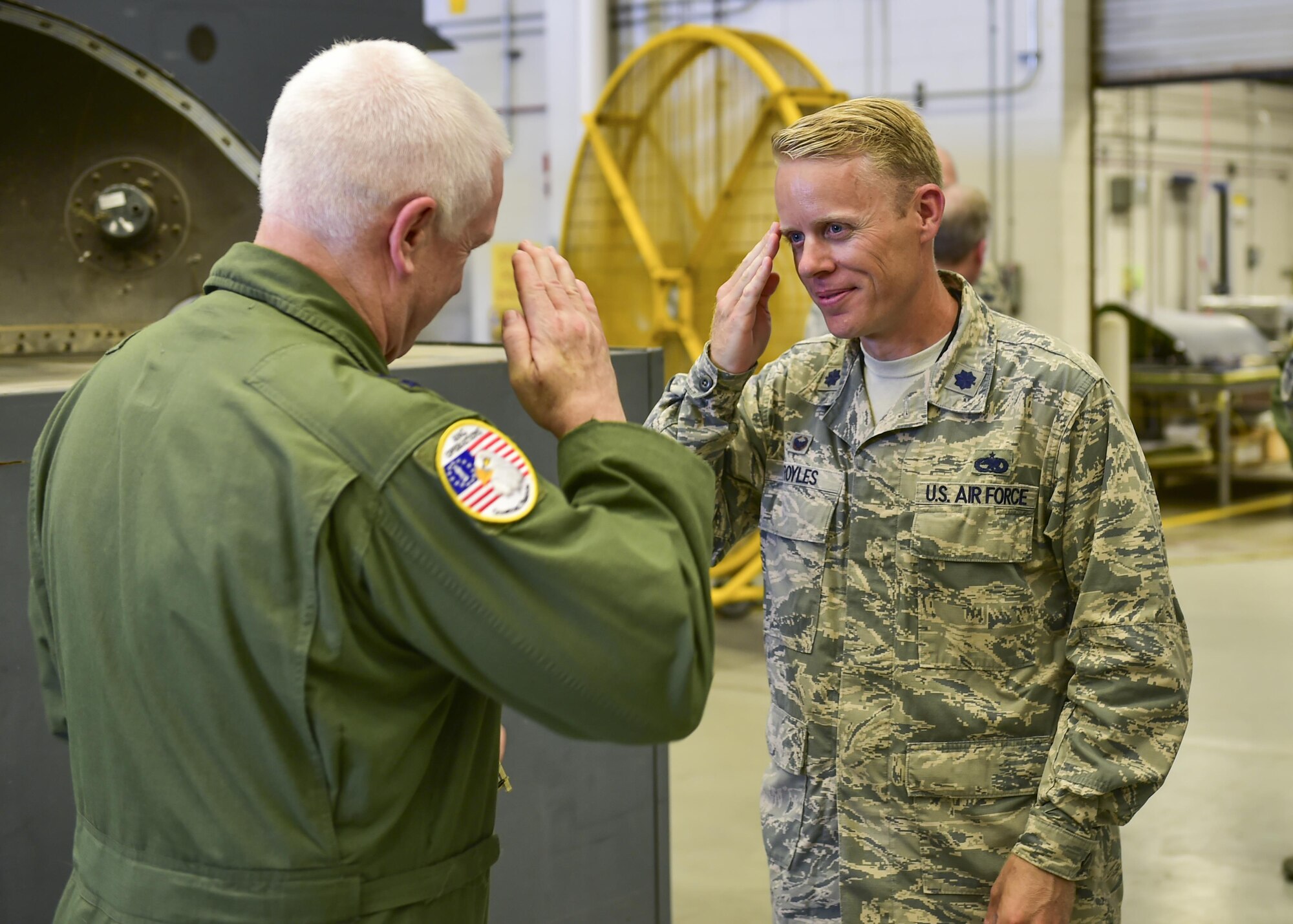 Lt. Col. Philip Broyles, commander of the 801st Special Operations Aircraft Maintenance Squadron, salutes Lt. Gen. L. Scott Rice, director of the Air National Guard, after receiving his coin at Hurlburt Field, Fla., July 7, 2016. Rice is responsible for formulating, developing and coordinating policies, plans and programs affecting more than 105,500 ANG members and civilians in more than 90 wings. (U.S. Air Force photo by Senior Airman Jeff Parkinson)