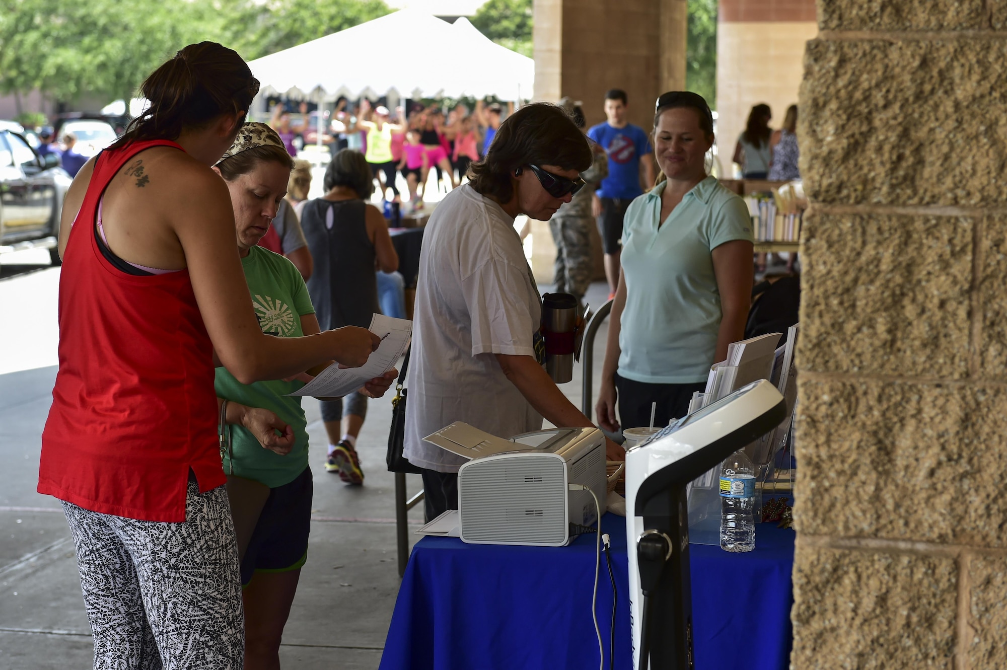 Health and Wellness Center representatives’ discuss healthy lifestyle choices with shoppers at the 2nd Annual Healthy Lifestyle Festival at Hurlburt Field, Fla., July 8, 2016. The festival was an opportunity for Airmen and their families to be educated on the importance of healthy lifestyle choices. (U.S. Air Force photo by Senior Airman Jeff Parkinson)