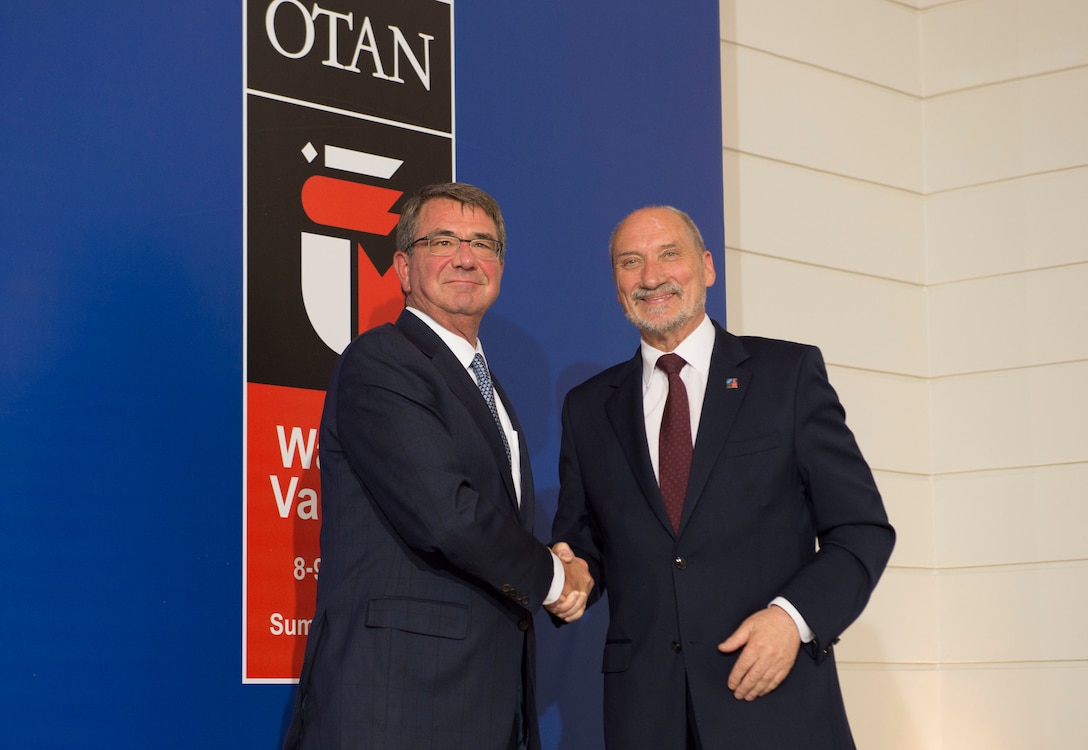 Defense Secretary Ash Carter, left, shakes hands with Polish Defense Minister Antoni Macierewicz at the NATO Summit in Warsaw, Poland, July 8, 2016. DoD photo by Navy Petty Officer 1st Class Tim D. Godbee