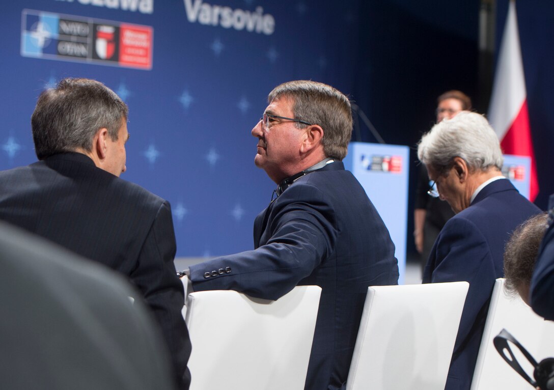 Defense Secretary Ash Carter, center, and Secretary of State John F. Kerry, right, await the arrival of President Barack Obama at the NATO Summit in Warsaw, Poland, July 8, 2016. DoD photo by Navy Petty Officer 1st Class Tim D. Godbee