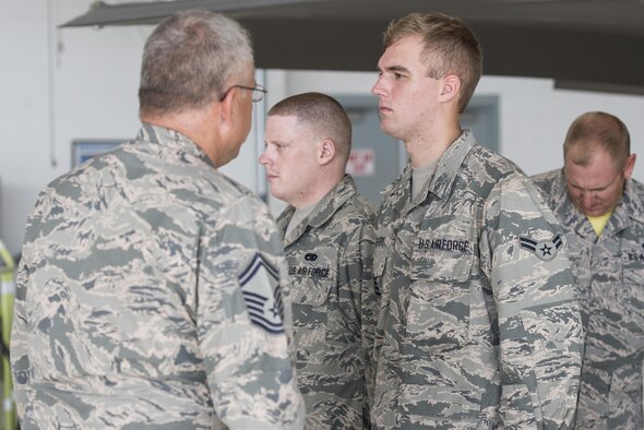 Staff Sgt. Dustin Smith and Senior Airman Paul Jeffrey, 33rd Aircraft Maintenance Squadron crew chiefs, are checked for dress and appearance standards during a dedicated crew chief competition July 8, 2016, at Eglin Air Force Base, Fla. Air Force crew chiefs are responsible for the day to day condition of the aircraft assigned to them. (U.S. Air Force photo by Senior Airman Stormy Archer/Released)