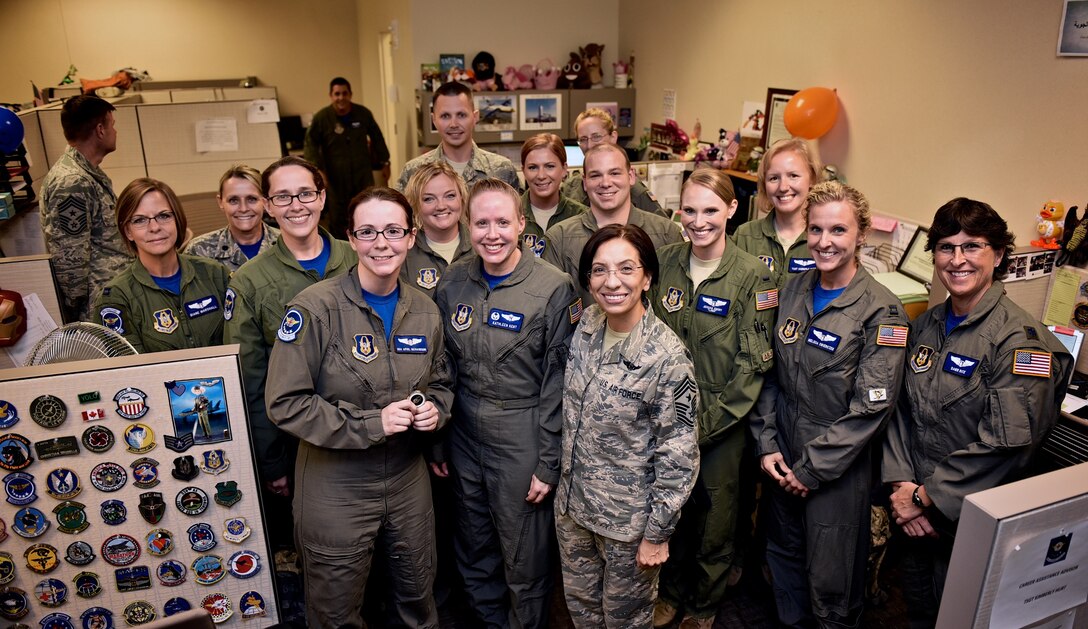 Senior Airman April Richardson, Aeromedical Evacuation Squadron technician stands next to Lt. Col. Kathleen Kent, center, AES commander and Chief Master Sergeant Ericka Kelly, Command Chief Master Sergeant, Air Force Reserve Command, Robins Air Force Base, Georgia along with several members from the 932nd AES during a coin presentation for Richardson, July 8, 2016, Scott Air Force Base, Illinois.   Kelly presented the coin as a token of Richardson's dedication to her AES family and remarkable performance.  Earlier in the day, Kelly gave a Command Chief's Perspective briefing as part of a Professional Development Seminar.  Kelly shared personal stories of her path to joining the Air Force and listened to Airman share their own.   (U.S. Air Force photo/Christopher Parr)
