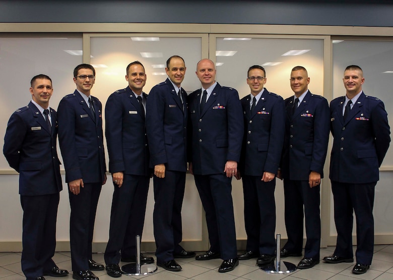 Airmen from Nellis Air Force Base, Nev., pose for a photo after graduating from the Family Medicine Residency Program at Mike O’Callaghan Federal Medical Center June 30. The primary goal of the program is to produce highly qualified, board-eligible family physicians capable of providing continuing and comprehensive care to the individual and family as an integrated unit, in any military or civilian medical system. 