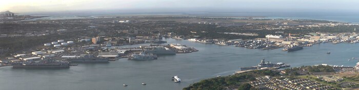 160701-N-SI773-700 JOINT BASE PEARL HARBOR-HICKAM (July 1, 2016) An aerial view of ships moored at Joint Base Pearl Harbor-Hickam for Rim of the Pacific 2016. Twenty-six nations, more than 40 ships and submarines, more than 200 aircraft, and 25,000 personnel are participating in RIMPAC from June 30 to Aug. 4, in and around the Hawaiian Islands and Southern California. The world's largest international maritime exercise, RIMPAC provides a unique training opportunity that helps participants foster and sustain the cooperative relationships that are critical to ensuring the safety of sea lanes and security on the world's oceans. RIMPAC 2016 is the 25th exercise in the series that began in 1971. (U.S. Navy Combat Camera photo montage by Mass Communication Specialist First Class Ace Rheaume/RELEASED)