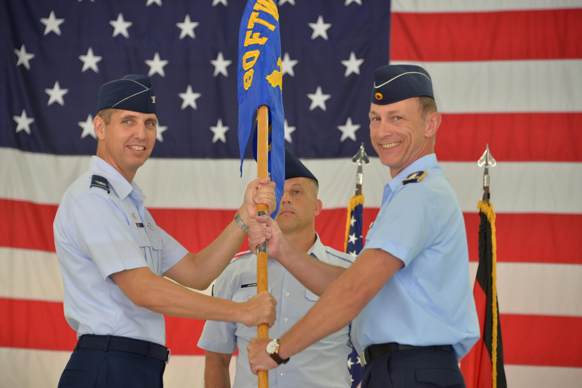 80th Flying Training Wing commander, Col. Gregory Keeton, officiates the 80th Operations Group change of command ceremony at Sheppard Air Force Base, Texas, July 6, 2016. Italian Air Force Col. Paolo Baldoasso, 80th Operations Group commander, relingquished his command to German Air Force Col. Bernhard Hey. (U.S. Air Force photo/ Elizabeth Colunga)
