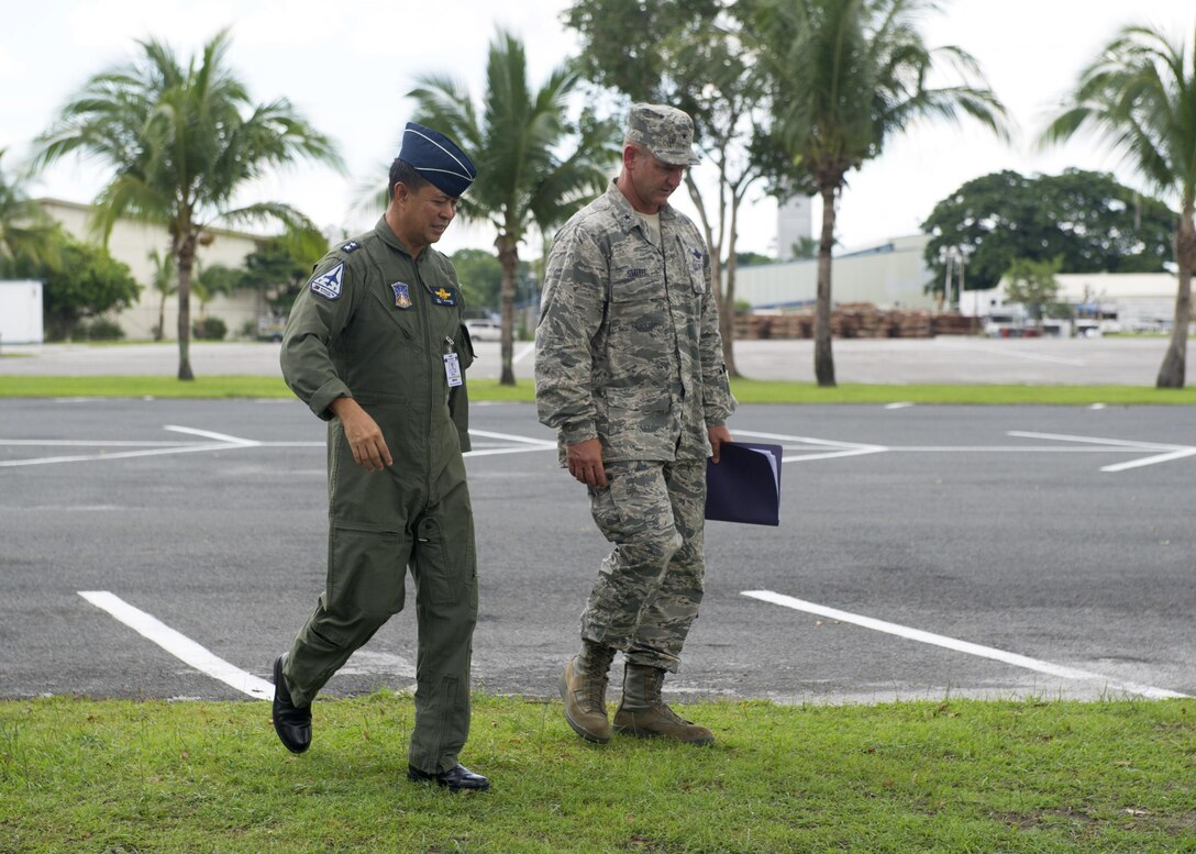 U.S. Air Force Brig. Gen. Dirk Smith, the Pacific Air Forces Director of Air and Cyberspace Operations, and Philippine Air Force Maj. Gen. Raul del Rosario, the PAF First Air Division commander, walk and discuss daily operations during a site visit to Clark Air Base, Philippines, June 29, 2016. The Electronic Attack Squadron (VAQ) 138 expeditionary detachment was at Clark to excercise bilaterally with Armed Forces of the Philippines members and provide support for routine operational missions that enhance regional maritime domain awareness. (U.S. Air Force photo by Staff Sgt. Alexander Martinez/Released) 