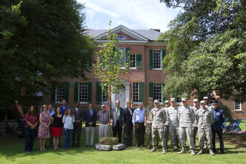 U.S. Army Col. Edward P. Chamberlayne, Commander and District Engineer Corps of Engineers, Baltimore District gathers with project team members during the commemoration of the Piscataway Creek Wetlands Mitigation Project at Poplar Hill Mansion in Clinton, Md., June 30, 2016. The Corps of Engineers supported the identification of 63 acres of land for wetland restoration, preservation and creation to mitigate the 12.5 acres of wetlands impacted by Joint Base Andrews' West Runway Repair Project. (U.S. Army photo by Alfredo Barraza)