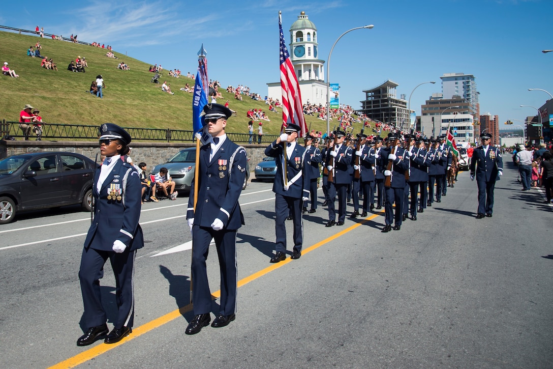 Members of the U.S. Air Force Honor Guard Drill Team march during a Canada Day parade as part of the 2016 Royal Nova Scotia International Tattoo in Halifax, Nova Scotia. Canada Day celebrates the actions on July 1, 1867, when Canada became a new federation with its own constitution. (U.S. Air Force photo by Senior Airman Ryan J. Sonnier)