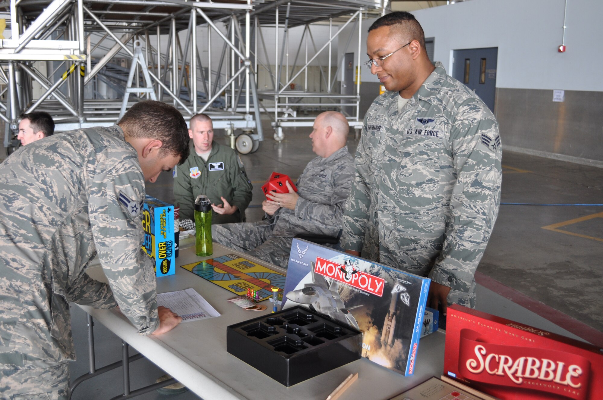 Airman 1st Class Aaron Rodrigues, 552nd Training Squadron, signs up for the Gaming Club as Senior Airman Josef Hoffarthharper, 960th Airborne Air Control Squadron and Gaming Club mentor, looks on. (Air Force photo by Ron Mullan/Released)