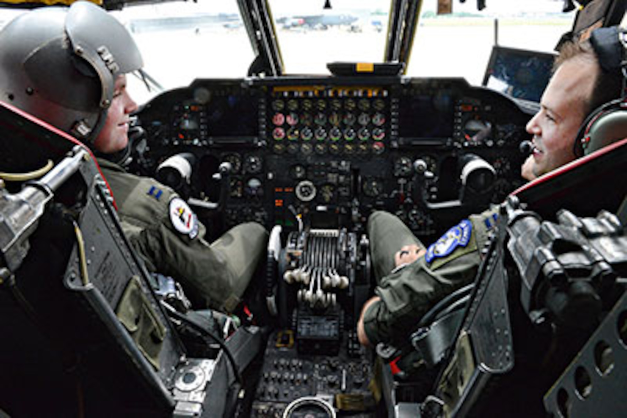 Capt. Shane Dow, aircraft commander, left, and Capt. Kevin Wiemann, co-pilot, both with the 20th Bomb Squadron out of Barksdale Air Force Base, La., perform pre-flight checks onboard the 12th B-52 to receive the CONECT upgrade. The digital upgrade will allow the flightcrew to send and receive almost instant data vital to their missions. (Air Force photo by Kelly White/Released)