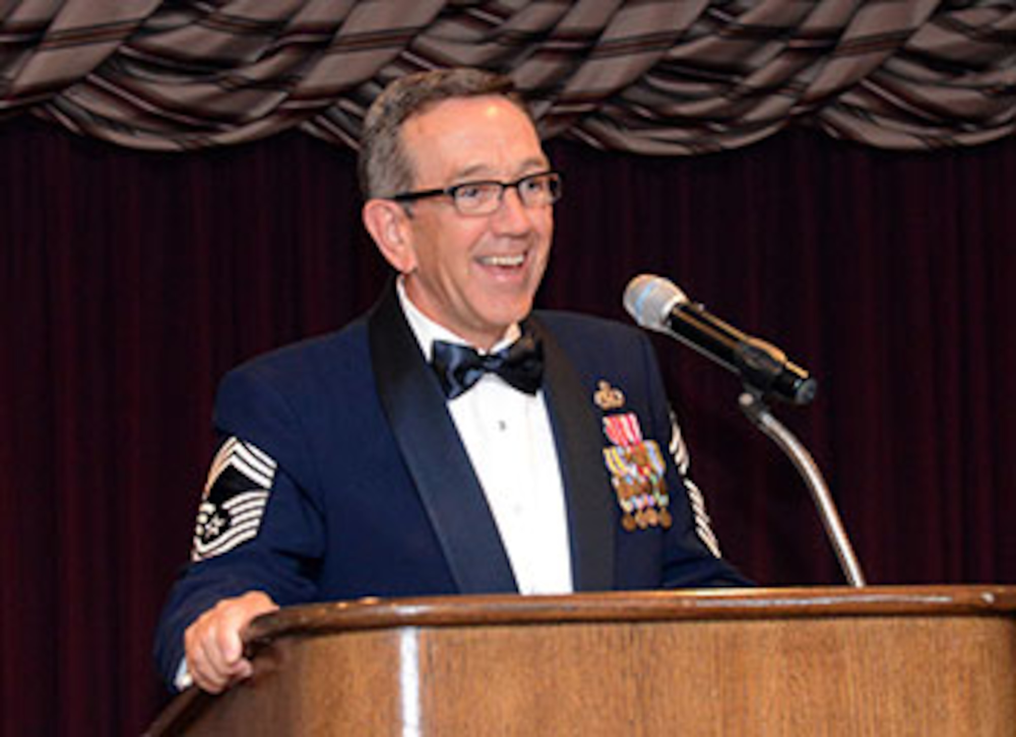 Frank Washburn, director of the 448th Supply Chain Management Wing and a retired chief master sergeant, was the guest speaker at the June 30 Airman Leadership School Graduation for Class 16-E. Mr. Washburn served more than 28 years on active duty and is currently a member of the Senior Executive Service. (Air Force photo by Kelly White/Released)