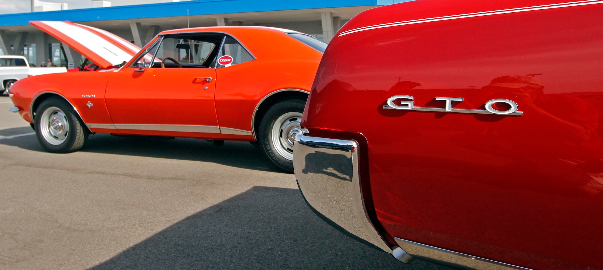 An orange Nickey Camaro sits next to a Pontiac GTO. (Cox Media Group photos/Skip Peterson)