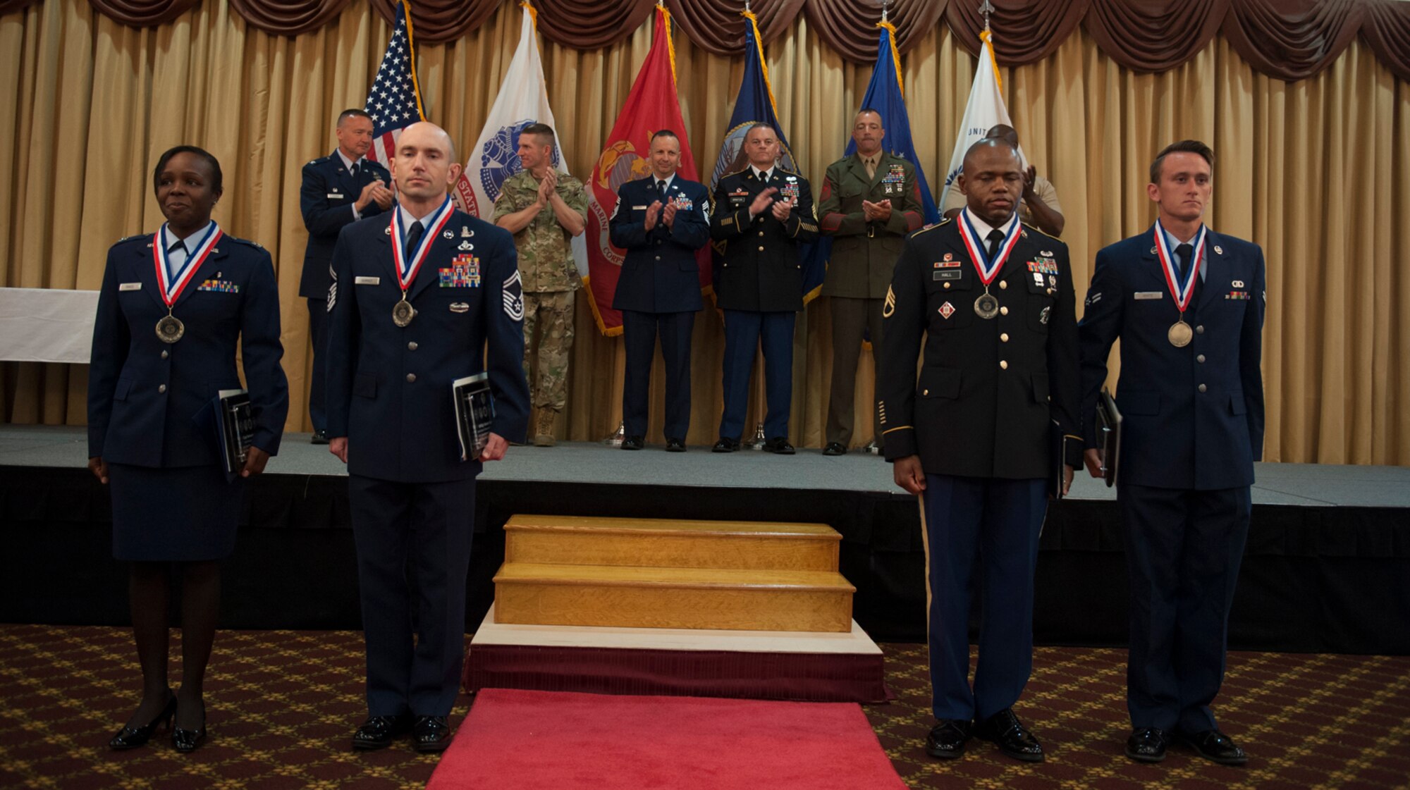 Winners of the Joint Base McGuire-Dix-Lakehurst's 2016 Service Member of the Year Competition are recognized for their achievement during an award ceremony at Tommy B's Community Center July 7, 2016. The two-day competition ranked each of the 11 competitor's on their physical and mental abilities. (U.S. Air Force photo by Airman 1st Class Zachary Martyn/Released)
