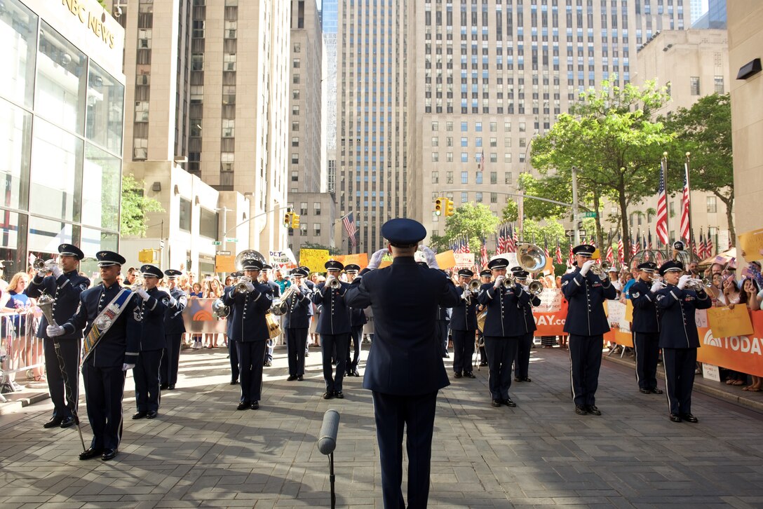 The Ceremonial Brass performed live on Rockefeller Plaza for NBC's The TODAY Show in New York City.  The July 4th performance featured Master Sergeant Tara Islas' arrangement of Strike Up The Band. (USAF Photo by Chief Master Sgt Bob Kamholz/released)