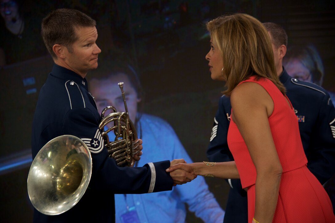 Technical Sergeant Joel Wealer shakes hands with Hoda Kotb after a special 4th of July performance by members of the Ceremonial Brass Quintet on Kathie Lee and Hoda on NBC's The TODAY Show. (USAF Photo by Chief Master Sgt Bob Kamholz/released)