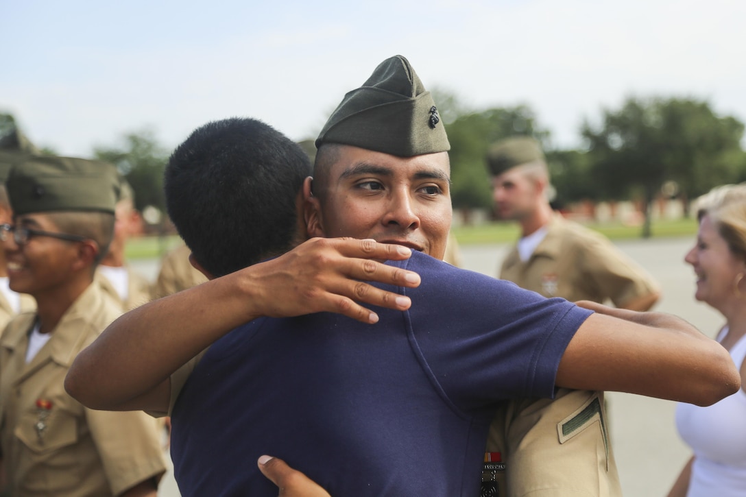 Marine Corps Pfc. Johnny Mendez hugs his brother, Edwin Mendez, after a Marine Corps basic training graduation ceremony in Parris Island, S.C., July 8, 2016. Mendez graduated after three months of Marine Corps basic training. Marine Corps photo by Lance Cpl. Colby Cooper