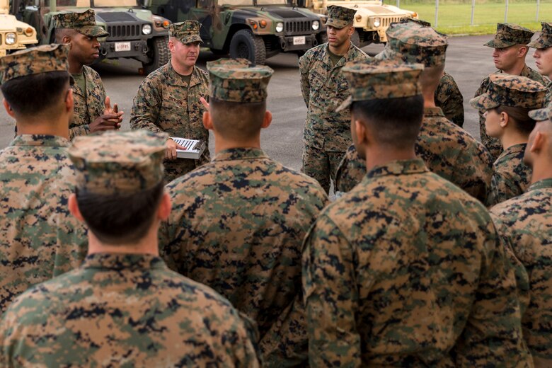 U.S. Marine Corps Staff Sgt. James Dickson, motor transport platoon first section leader with Marine Wing Support Squadron (MWSS) 171 briefs Marines upon arrival to Combined Arms Training Center Camp Fuji, Japan, to participate in exercise Eagle Wrath 2016 on July 7, 2016. The annual exercise focuses on providing aviation-ground support to an assigned aviation combat element while reinforcing skills that Marines learned throughout their military occupational specialty schooling and Marine Combat Training. The squadron plans to complete their unit annual training requirements throughout three stages, which focuses on air base ground defense and Marine Corps common skills that Marines are unable to train for locally. (U.S. Marine Corps photo by Lance Cpl. Aaron Henson/Released)