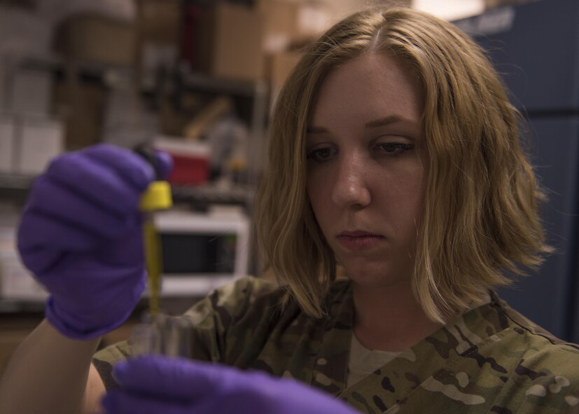 Staff Sgt. Megan Montagnino, 455th Expeditionary Medical Group non-commissioned officer in charge of microbiology and the blood bank, drops antibodies into a patient's red blood cells, July 08, 2016, Bagram Airfield, Afghanistan. Montagnino mixed antibodies with a sample of a patient’s blood to verify the blood type. (U.S. Air Force photo by Senior Airman Justyn M. Freeman)