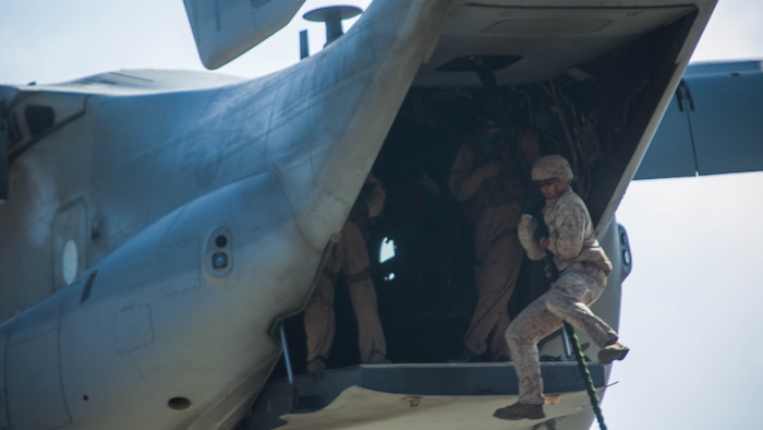 Marines with 2nd Battalion, 5th Marine Regiment, Weapons Company, Scout Sniper Platoon, fast rope from an MV-22B Osprey with Marine Medium Tiltrotor Squadron 164 aboard Marine Corps Base Camp Pendleton, Calif., June 30. The ability to fast rope enables Marines to insert into an area or structure without landing the aircraft, eliminating the need for a landing zone. 