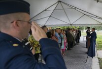 Chaplain John Rollyson and others render courtesies during the National Anthem at the 919th Special Operations Wing headquarters building dedication ceremony at Duke Field, Fla., July 8.  The building was dedicated to the 919th’s founding member, retired Brig. Gen. Donald Haugen, who created the 919th Tactical Airlift Group in 1971.  (U.S. Air Force photo/Tech. Sgt. Sam King)
