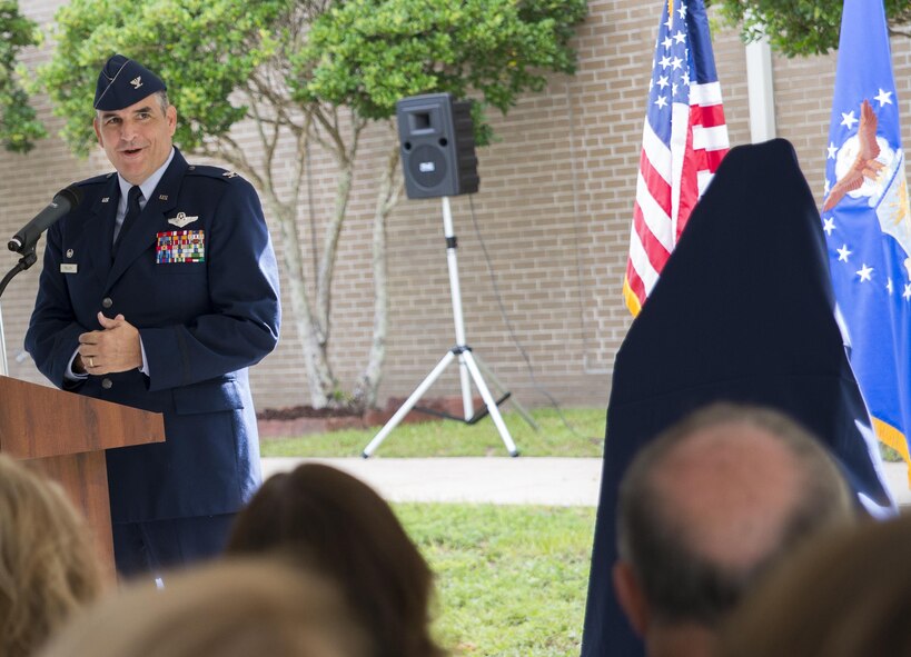 Col. James Phillips, the 919th Special Operations Wing commander, speaks to the crowd at the wing headquarters building dedication ceremony at Duke Field, Fla., July 8.  The building was dedicated to the 919th’s founding member, retired Brig. Gen. Donald Haugen, who created the 919th Tactical Airlift Group in 1971.  (U.S. Air Force photo/Tech. Sgt. Sam King)