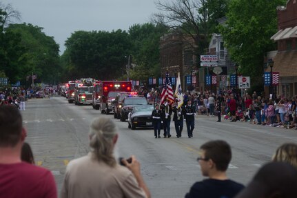 From left, Spc. Abigail Billups, Staff Sgt. Luis Lopez, Sgt. Stephen Galvin, and Staff Sgt. Adam Tracy, all assigned to the 416th Theater Engineer Command, march through Brookfield, Illinois, as members of the color guard, during the Independence Day parade, Jul. 4, 2016. (U.S. Army photo by Staff Sgt. Jason Proseus/Released)