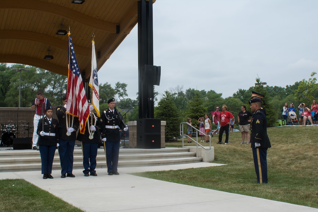 From left, Spc. Abigail Billups, Staff Sgt. Luis Lopez, Sgt. Stephen Galvin, Staff Sgt. Adam Tracy, Sgt. Peter Garcia, and Cpt. Zachary Galaboff, all assigned to the 416th Theater Engineer Command, await the first note of “The Star Spangled Banner” before rendering honors to the American Flag and the singing of the national anthem, Jul. 4, 2016. The Independence Day celebration in Brookfield, Illinois began with the singing of the national anthem, preceded by an invocation. (U.S. Army photo by Staff Sgt. Jason Proseus/Released)