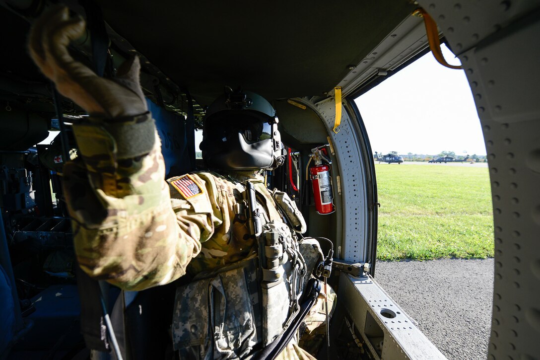 Sgt. Brandon Vititoe, a crew chief from the 11th Theater Aviation Command, conducts pre-flight checks during a joint training exercise with the 19th Engineer Battalion. The training took place on Fort Knox, Ky., from Jun 27-29. (Photos by Kevin Coates / Fort Knox Visual Information)