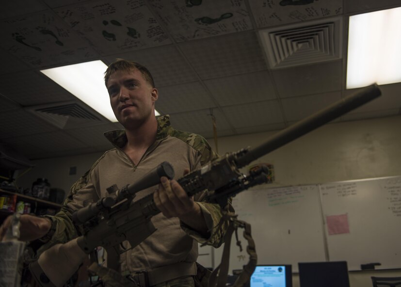 Senior Airman Jarad Frey, 83rd Expeditionary Rescue Squadron pararescueman, function checks his weapon, June 09, 2016, Bagram Airfield, Afghanistan. Performing function checks ensure their weapons work properly when needed. (U.S. Air Force photo by Senior Airman Justyn M. Freeman)