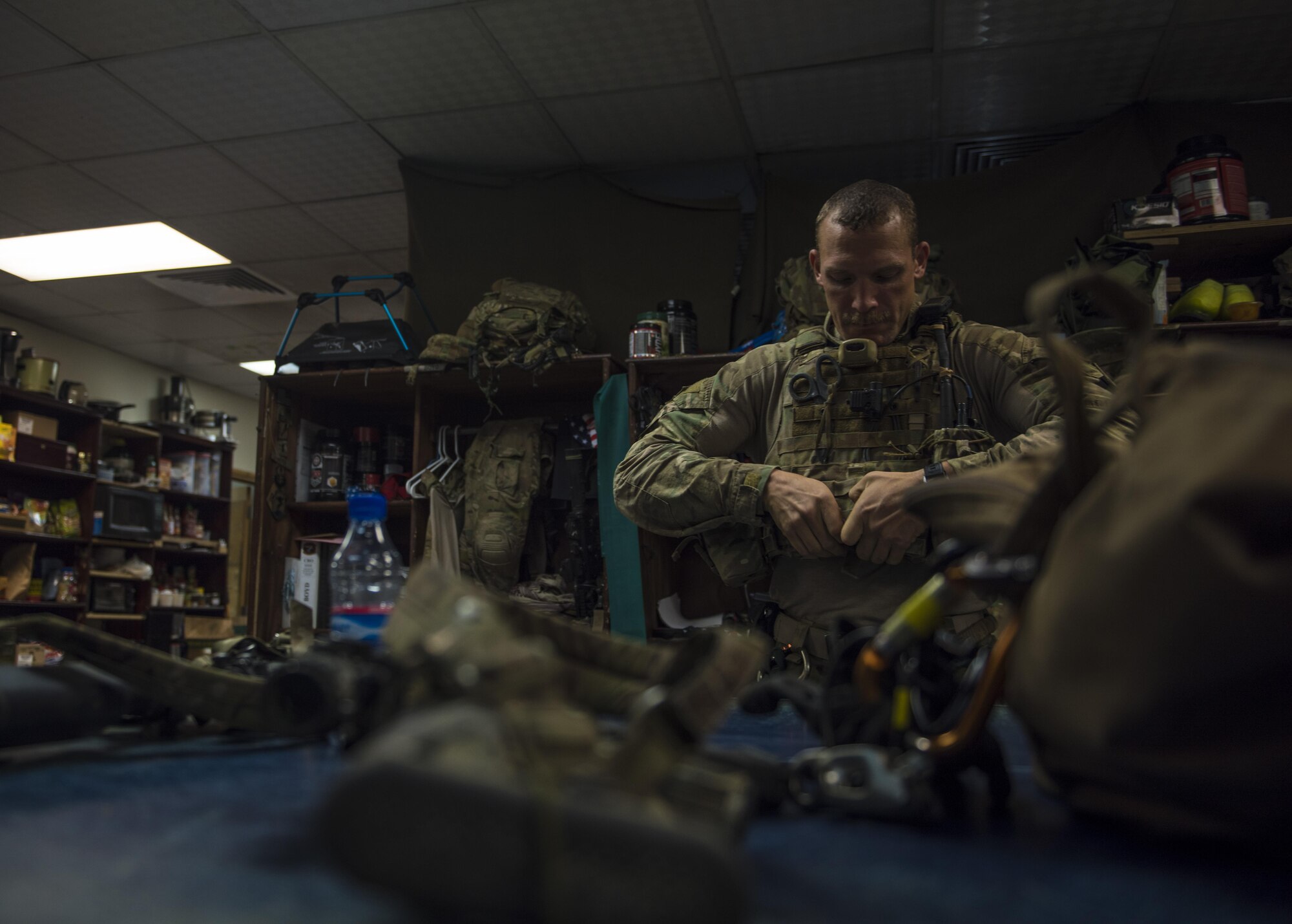 Staff Sgt. Roderick Campbell, 83rd Expeditionary Rescue Squadron pararescueman, puts on his gear in preparation for a personnel recovery exercise, June 09, 2016, Bagram Airfield, Afghanistan. Members of the 83rd ERQS practice personnel recovery and work with other air assets to eliminate threats in the area and safely recover isolated personnel. (U.S. Air Force photo by Senior Airman Justyn M. Freeman)
