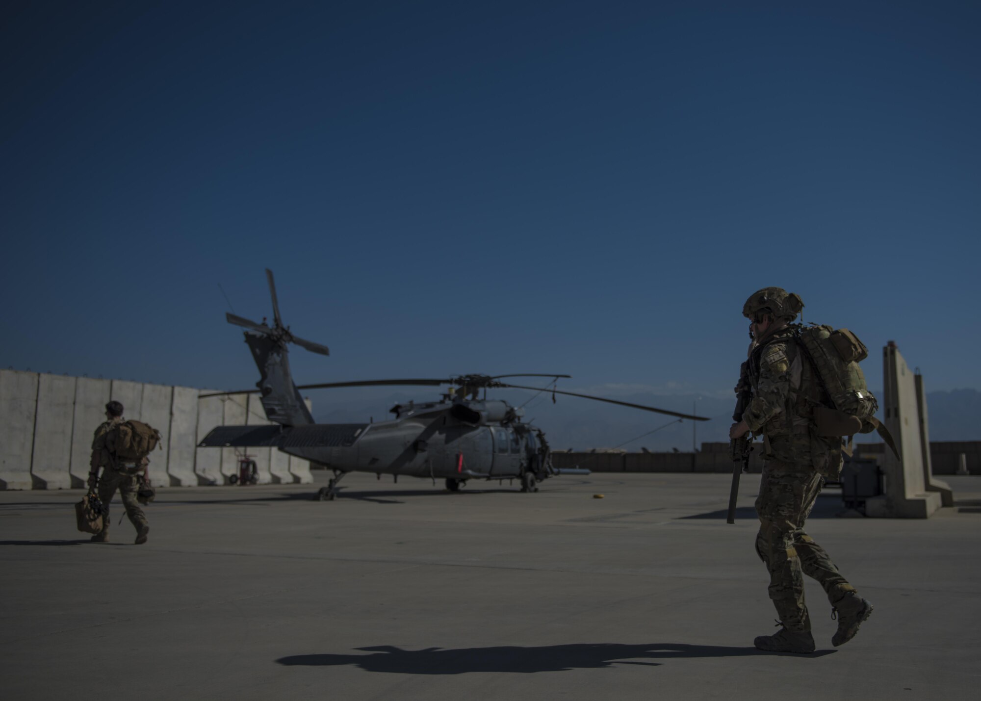 Senior Airman Jarad Frey, 83rd Expeditionary Rescue Squadron pararescueman, makes his way to a HH-60G Pave Hawk, June 09, 2016, Bagram Airfield, Afghanistan. Members of the 83rd ERQS practice personnel recovery and work with other air assets to eliminate threats in the area and safely recover isolated personnel. (U.S. Air Force photo by Senior Airman Justyn M. Freeman)