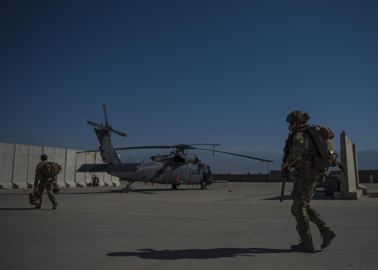 Senior Airman Jarad Frey, 83rd Expeditionary Rescue Squadron pararescueman, makes his way to a HH-60G Pave Hawk, June 09, 2016, Bagram Airfield, Afghanistan. Members of the 83rd ERQS practice personnel recovery and work with other air assets to eliminate threats in the area and safely recover isolated personnel. (U.S. Air Force photo by Senior Airman Justyn M. Freeman)