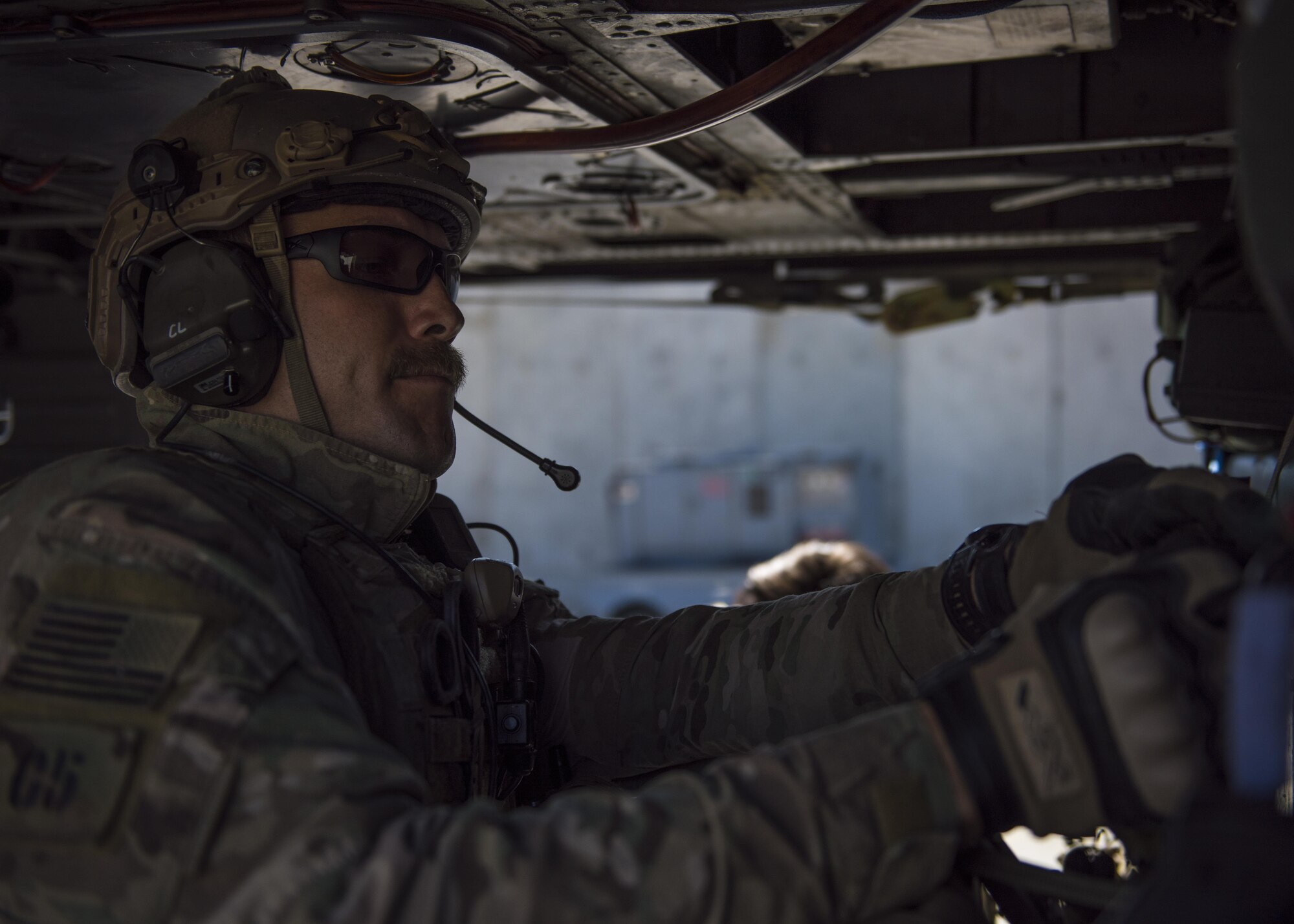 Staff Sgt. Roderick Campbell, 83rd Expeditionary Rescue Squadron pararescueman, buckles his gear to an HH-60G Pave Hawk, June 09, 2016, Bagram Airfield, Afghanistan. Campbell clips his medical gear to the interior of aircraft to use, if necessary, during a personnel recovery exercise. (U.S. Air Force photo by Senior Airman Justyn M. Freeman)