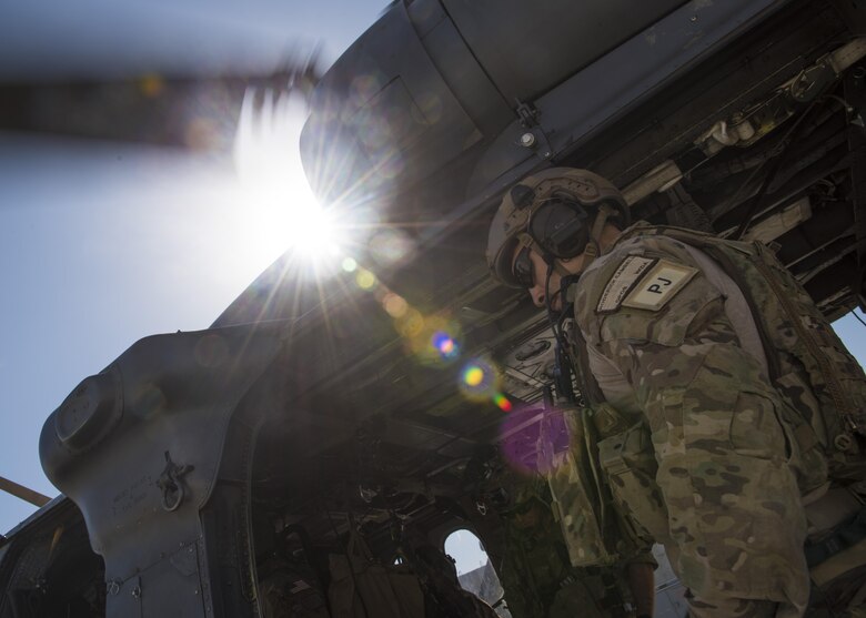 Staff Sgt. Roderick Campbell, 83rd Expeditionary Rescue Squadron pararescueman, boards an HH-60G Pave Hawk participating in a personnel recovery exercise, June 09, 2016, Bagram Airfield, Afghanistan. The 83rd ERQS provides the only isolated personnel recovery capability to U.S. forces in Afghanistan. (U.S. Air Force photo by Senior Airman Justyn M. Freeman)