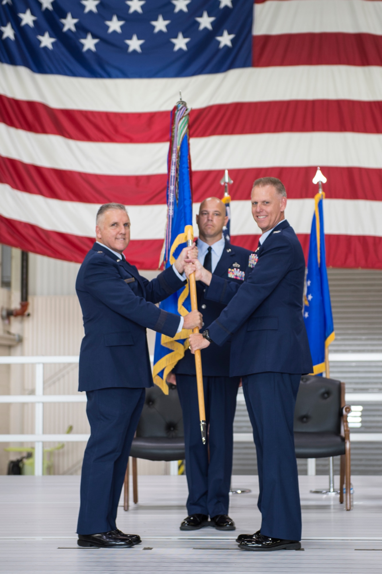 Maj. Gen. John Flournoy, 4th Air Force commander, presents the 434th Air Refueling Wing flag to Col. Larry Shaw as the colonel assumes command of the wing at Grissom Air Reserve, Base, Ind., July 9, 2016. Also pictured is Chief Master Sgt. Robert Herman, 434th ARW command chief, who served as guidon bearer. (U.S. Air Force Photo/ Tech. Sgt. Benjamin Mota)  
