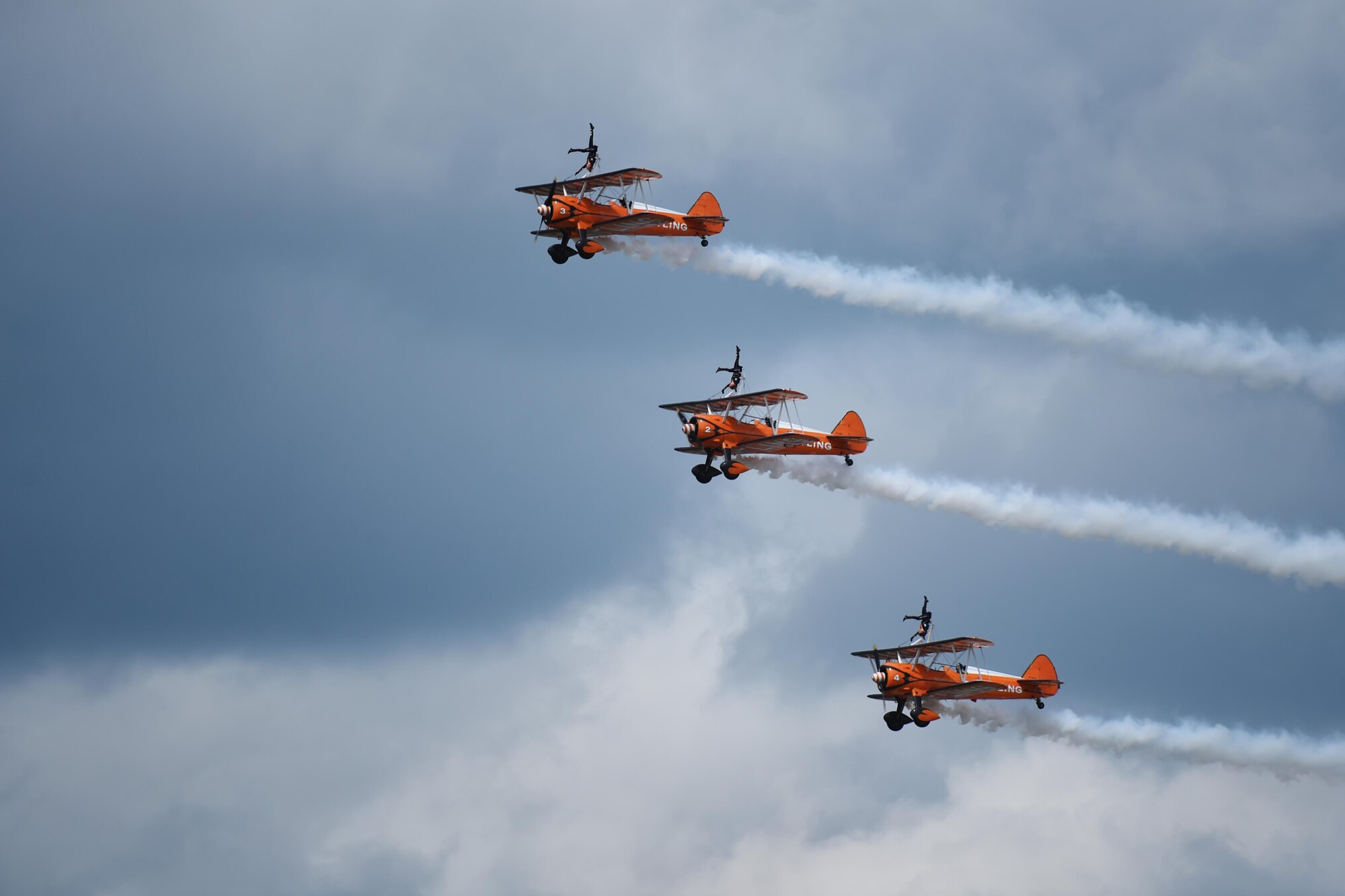 Wing walkers perform at the 2016 Royal International Air Tattoo, held on RAF Fairford, United Kingdom, June 8-10, 2016. RIAT 16 afforded an opportunity for new aircraft, like the F-35 Lightning II, to be displayed alongside crowd favorites and provided a weekend of fun and entertainment for the projected 160,000 visitors. (U.S. Air Force photo by Airman 1st Class Zachary Bumpus/Released)